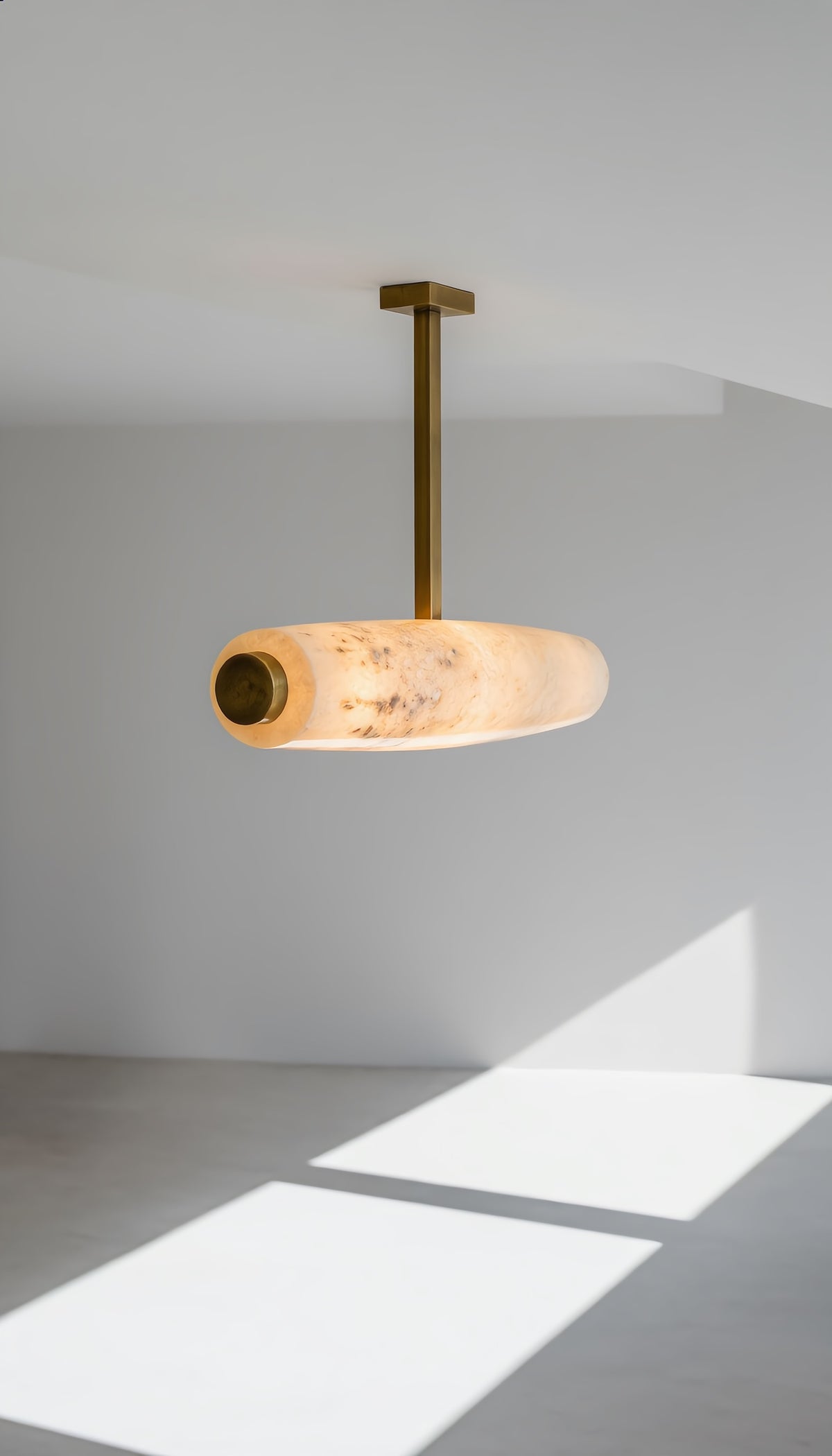 Original reference photograph of alabaster and brass cylinder pendant light