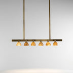 Original photograph of six alabaster shades on a brass linear pendant with two suspension rods
