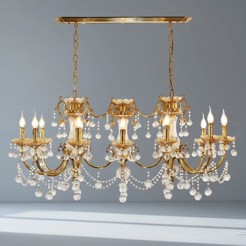 Traditional linear brass and crystal chandelier against a cool gray studio backdrop with natural window light
