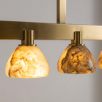 AI-generated reference close-up of alabaster shades and brass connectors